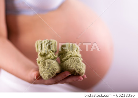 The belly of a pregnant woman, she is waiting for The belly of a pregnant woman, she is waiting for 66238350