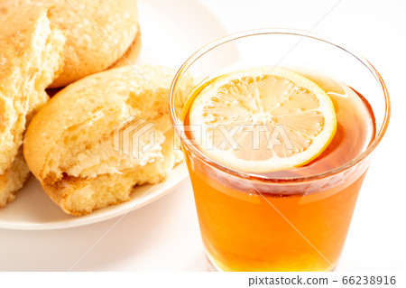 Iced lemon tea. Busse split by hand in the back of the photo. 66238916