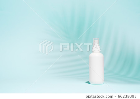 Empty spray container on clean blue background 66239395