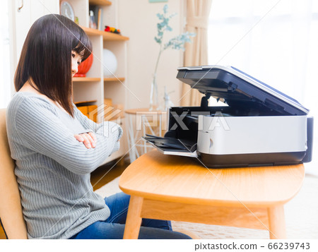 Woman opening the printer trouble trouble ink exchange copy space 4:3 66239743