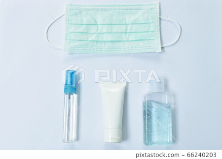 hygienic mask for protection nose and mouth with alcohol or gel based hand sanitizer for washing and cleaning disease in white background 66240203