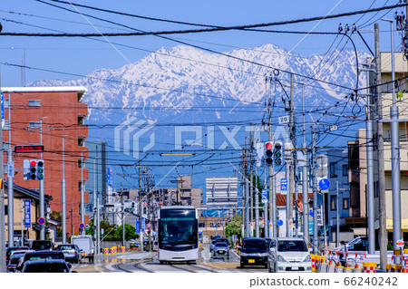 Toyama tram and Tateyama mountain range Toyama tram and Tateyama mountain range 66240242
