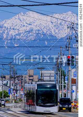 Toyama tram and Tateyama mountain range Toyama tram and Tateyama mountain range 66240244