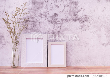 Picture frame with flowers on wall background and 66240308