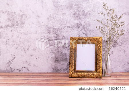 Picture frame with flowers on wall background and Picture frame with flowers on wall background and 66240321