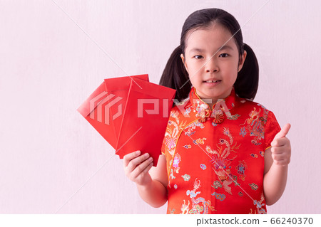 Asian girl wear cheongsam and take Red envelopes 66240370