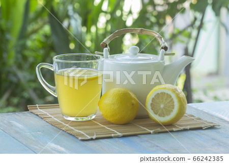 Hot tea cup with lemon and Teapot Hot tea cup with lemon and Teapot 66242385