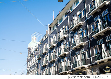 Amsterdam cityscape, Holland Historic building made of brick with gray walls Amsterdam cityscape, Holland Historic building made of brick with gray walls 66243104