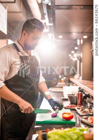 Chef working with red onion 66243670