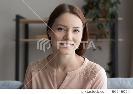 Headshot portrait of smiling young woman relax at home Headshot portrait of smiling young woman relax at home 66246034
