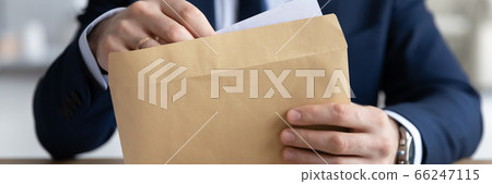 Panoramic view of businessman open postal correspondence Panoramic view of businessman open postal correspondence 66247115