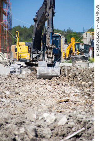 A large construction excavator of yellow color 66249038