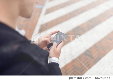 Close up of male hands holding smartphone Close up of male hands holding smartphone 66250633