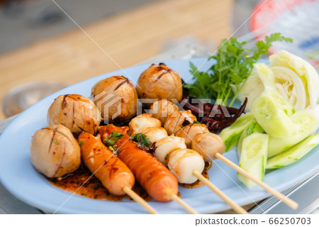 Meatballs toasted on wood dish and a sauce 66250703