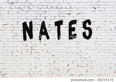 Word nates painted on white brick wall Word nates painted on white brick wall 66254178