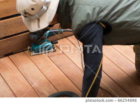Craftsman making a wood deck Craftsman making a wood deck 66254898
