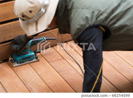 Craftsman making a wood deck Craftsman making a wood deck 66254899