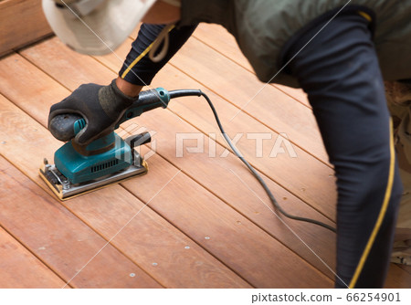 Craftsman making a wood deck Craftsman making a wood deck 66254901
