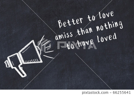 Chalk loudspeaker and wise quote on black desk 66255641