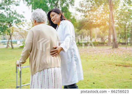 Doctor help and care Asian senior or elderly old lady woman use walker 66256023
