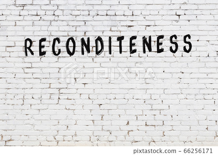 Word reconditeness painted on white brick wall 66256171