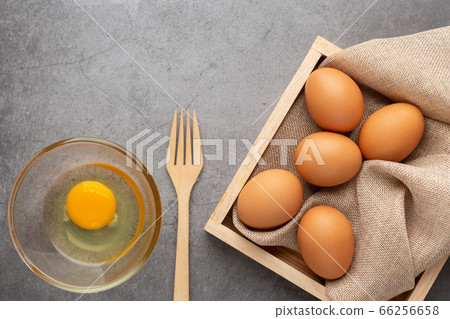 Chicken eggs on the wooden tray, fork and glass Chicken eggs on the wooden tray, fork and glass 66256658