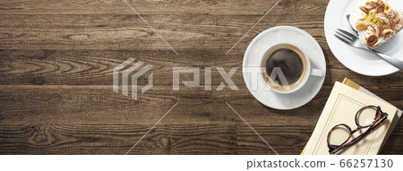 Coffee, cake and books on the table 66257130