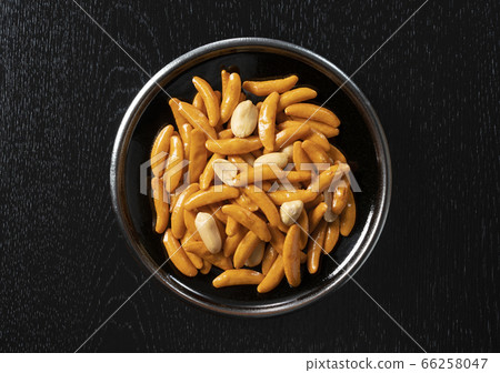 Persimmon seeds on a black background 66258047