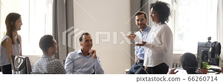 African team leader talking to colleagues at office meeting African team leader talking to colleagues at office meeting 66260714