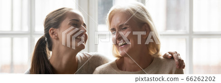 Happy aged mother her adult daughter spending time together Happy aged mother her adult daughter spending time together 66262202