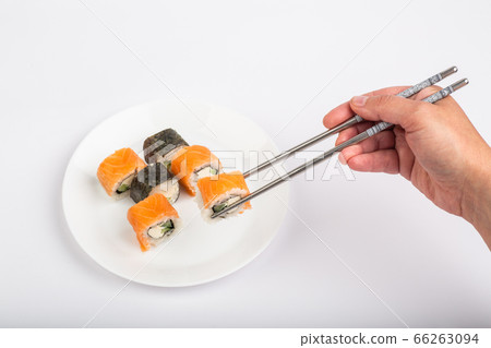 Roll of sushi on a plate, Sushi roll on a table 66263094