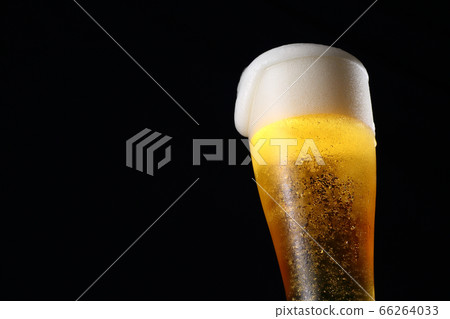Draft beer, black background Draft beer, black background 66264033