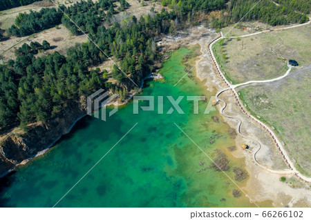 Aerial view of wooden path over turquiose lake Aerial view of wooden path over turquiose lake 66266102