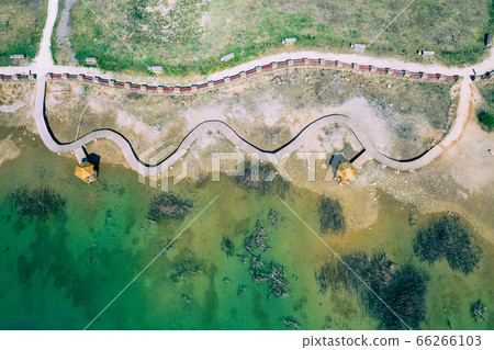 Aerial view of wooden path over turquiose lake Aerial view of wooden path over turquiose lake 66266103
