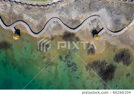 Aerial view of wooden path over turquiose lake Aerial view of wooden path over turquiose lake 66266104