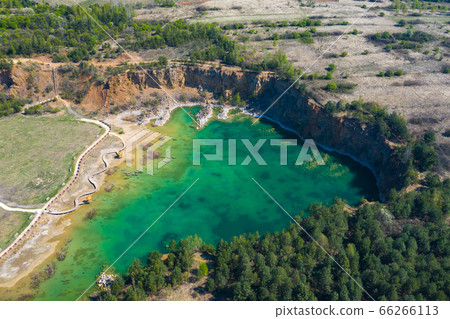 Aerial view of wooden path over turquiose lake Aerial view of wooden path over turquiose lake 66266113