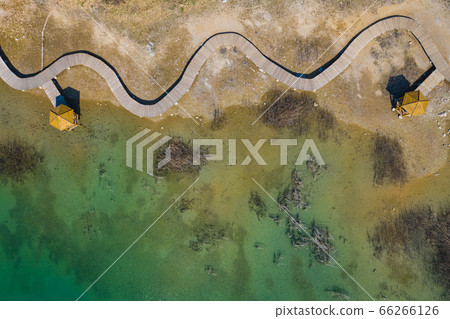 Aerial view of wooden path over turquiose lake Aerial view of wooden path over turquiose lake 66266126