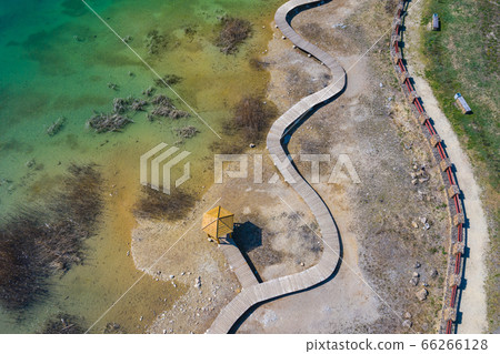 Aerial view of wooden path over turquiose lake Aerial view of wooden path over turquiose lake 66266128