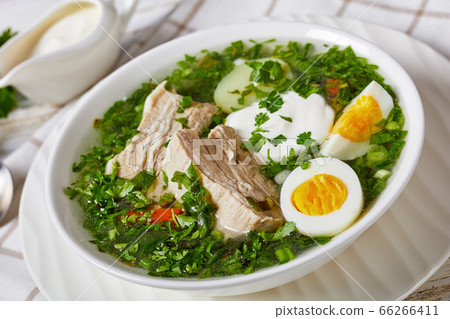 Healthy green sorrel soup with eggs and pork ribs Healthy green sorrel soup with eggs and pork ribs 66266411