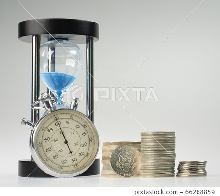 time and money. hourglass and stopwatch with time and money. hourglass and stopwatch with 66268859