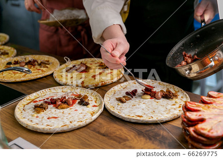 Chef decorates a dish of rabbit tongue and kidneys. Master class in the kitchen. The process of Chef decorates a dish of rabbit tongue and kidneys. Master class in the kitchen. The process of 66269775
