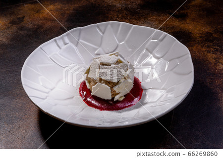 Meringue dessert. The combination of tender meringue, light protein and cream, juicy prunes and Meringue dessert. The combination of tender meringue, light protein and cream, juicy prunes and 66269860