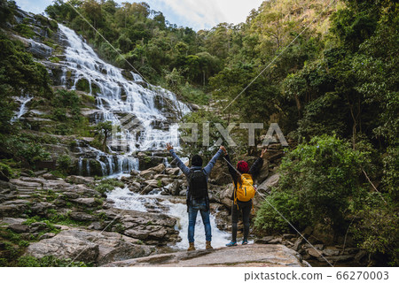 Travel relax to visit the waterfalls of couples. In the winter. at the waterfall mae ya chiangmai 66270003