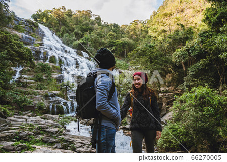 Travel relax to visit the waterfalls of couples. In the winter. at the waterfall mae ya chiangmai Travel relax to visit the waterfalls of couples. In the winter. at the waterfall mae ya chiangmai 66270005