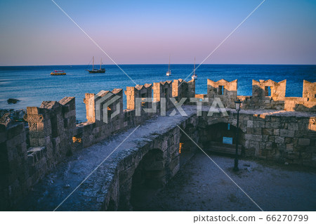 Rhodes old town stone walls in the evening. Rhodes old town stone walls in the evening. 66270799