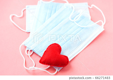 Blue cloth medical masks with red heart on pink Blue cloth medical masks with red heart on pink 66271483