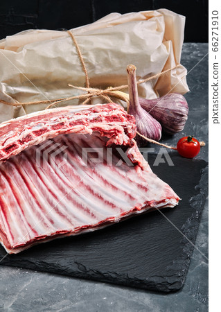 Lamb ribs fresh meat, with eco-friendly packaging. Food Delivery Concept. copy space, dark background 66271910