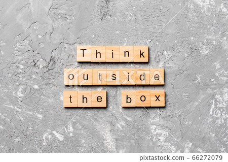 Think outside the box word written on wood block. 66272079