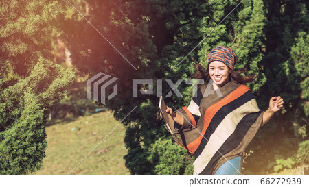 Asian woman relax in the holiday. Travel nature and  write a note in the notebook 66272939