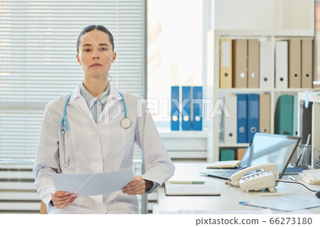 Confident Female Doctor Posing in Clinic Confident Female Doctor Posing in Clinic 66273180